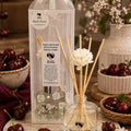 100ml Black Cherry reed diffuser with decorative floral reeds by Miss Jules Melts & Crafts.