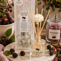 100ml Dewberry reed diffuser with decorative floral reeds by Miss Jules Melts & Crafts.